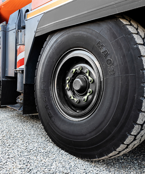 MA03 tire equipped on a mobile crane, designed for maximum grip, wear resistance, and stability on construction and industrial sites.